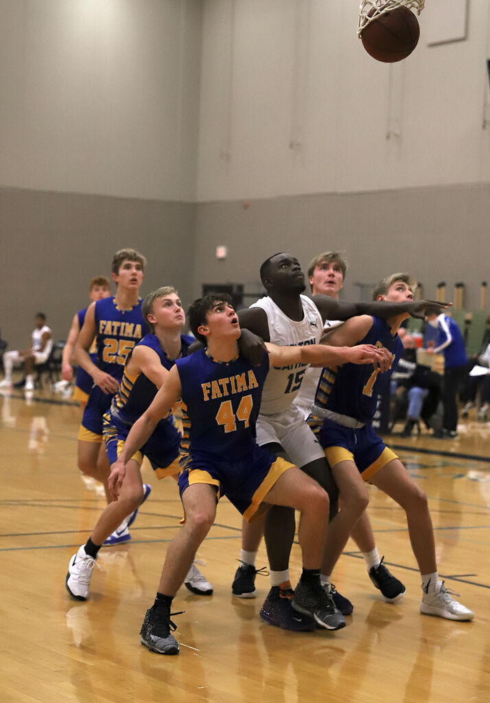 Jacob Vanderfeltz and Evens Appolon watch the ball